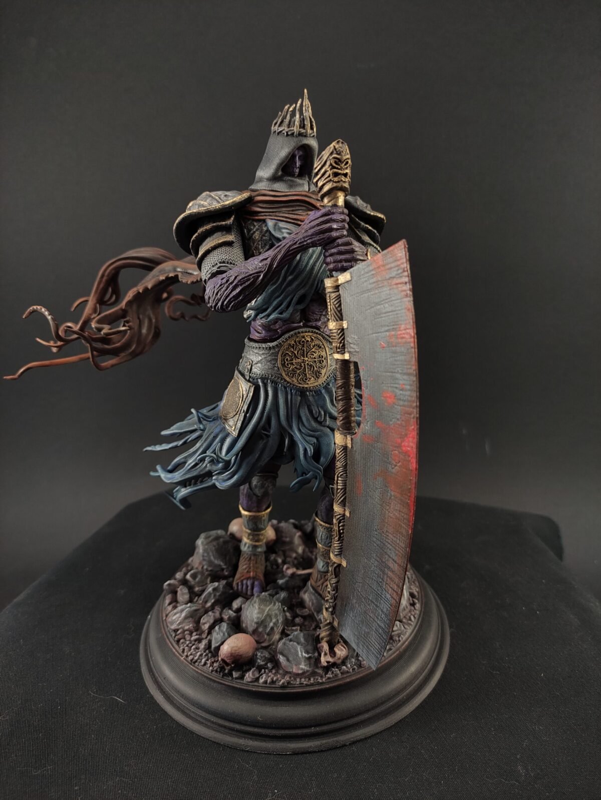 Full-body view of Yhorm on throne in contemplative pose with sculpted base