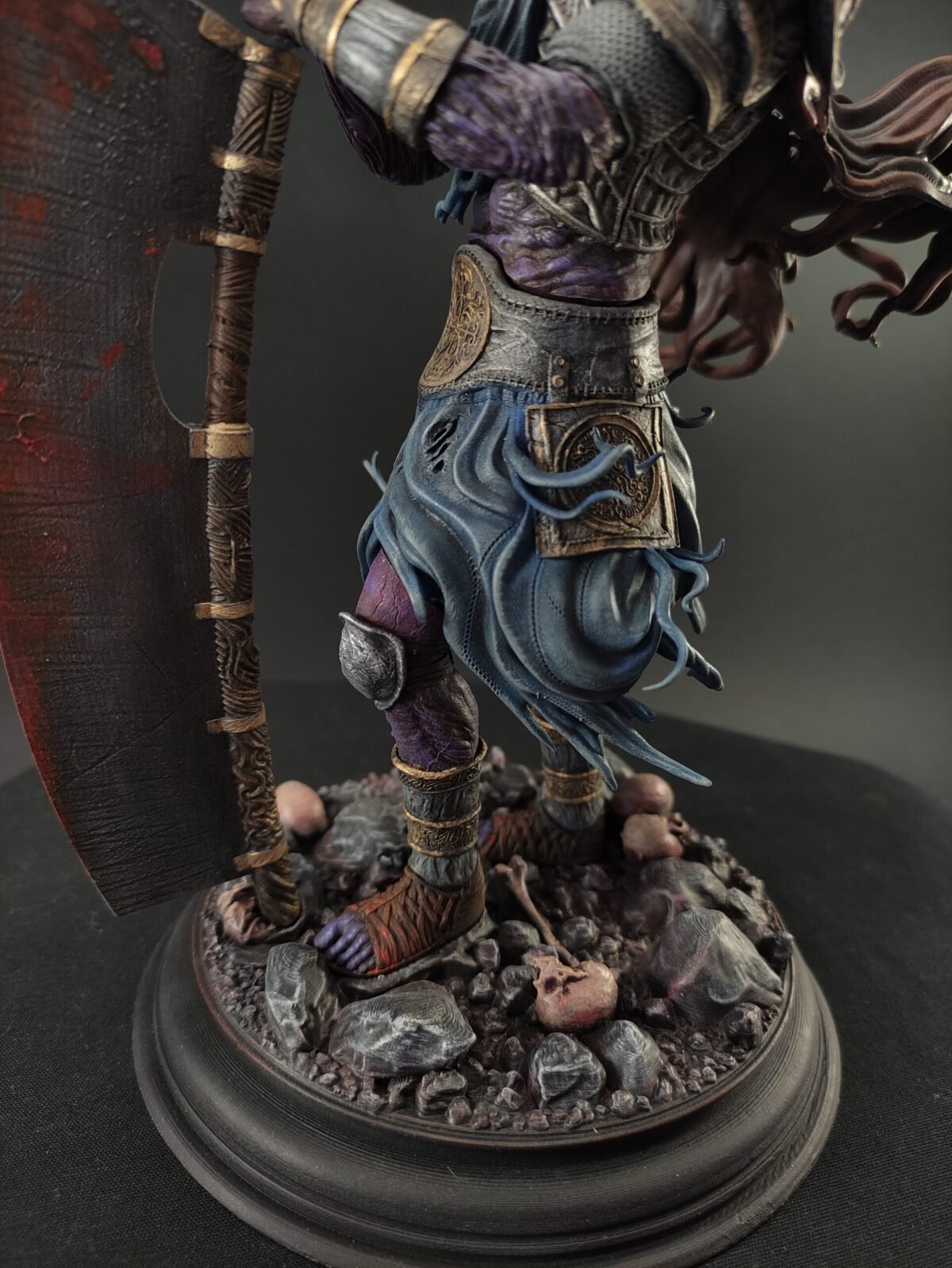 Low angle emphasizing Yhorm’s size, shoulder armor, and worn textures