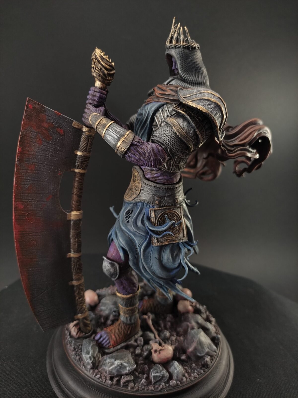 Dramatic view of giant figure seated in silence with weapon and throne details