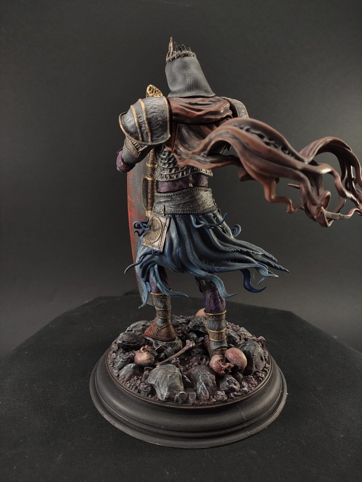 Back view highlighting throne detail, flowing cape, and armor textures