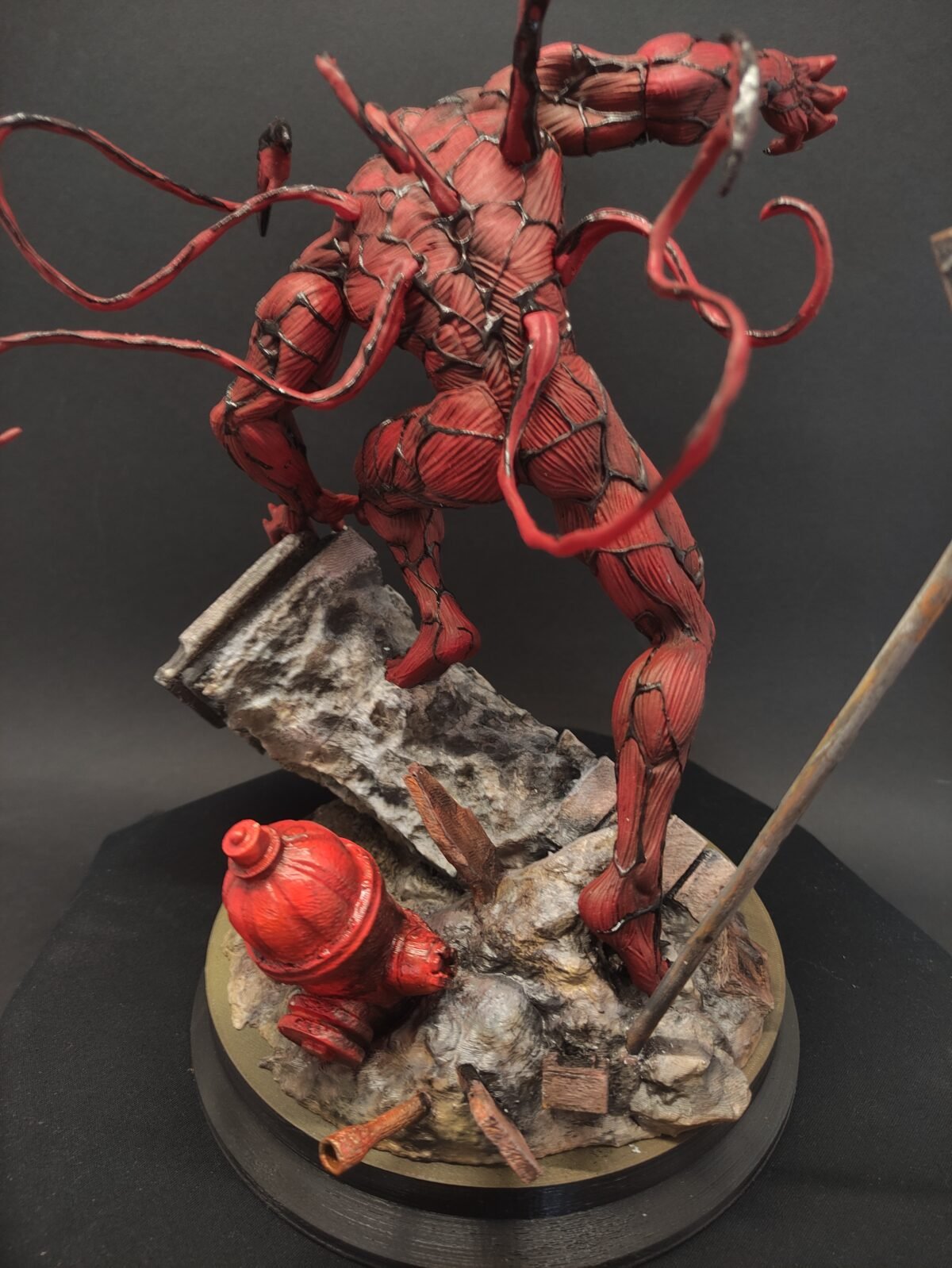 Rear close-up showing symbiote texture and fluid motion effect