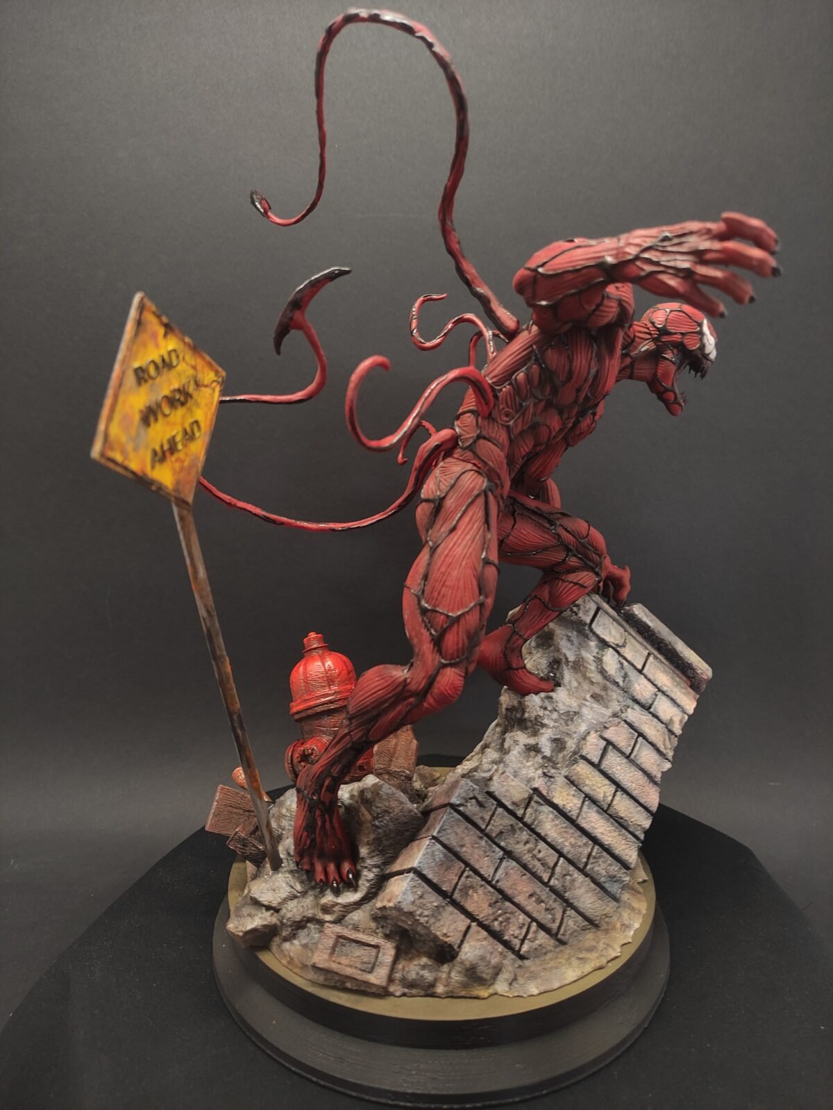 Rear angle revealing tendrils wrapping around the body