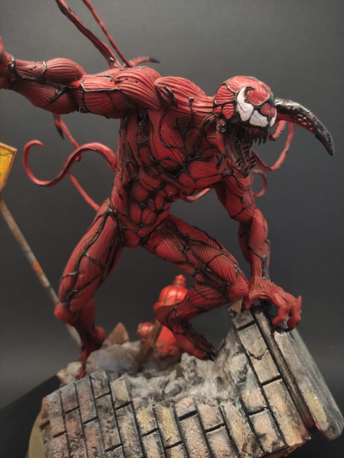 Side view showing twisted torso, claws, and sinewy symbiote texture