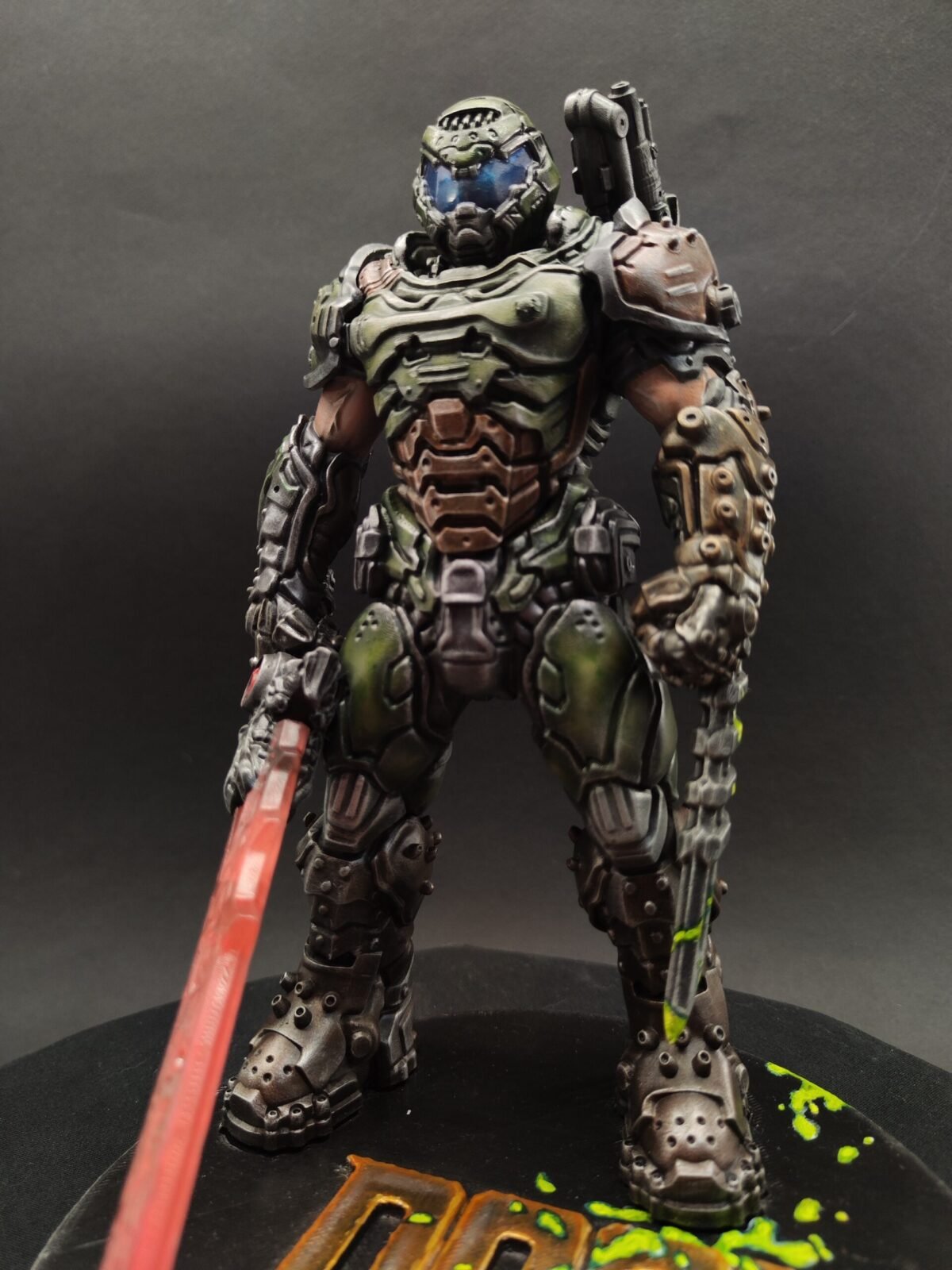 Angled front shot showing sculpted helmet, chest armor, and combat posture