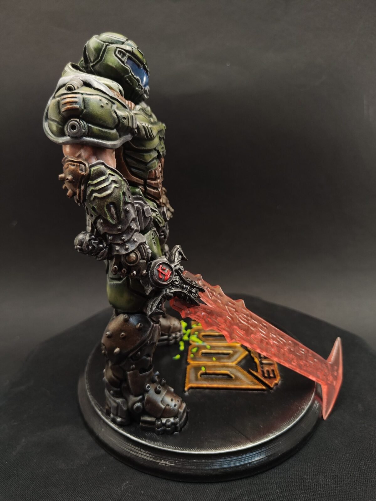 Right-side view of Slayer in battle-ready stance with weapon lowered