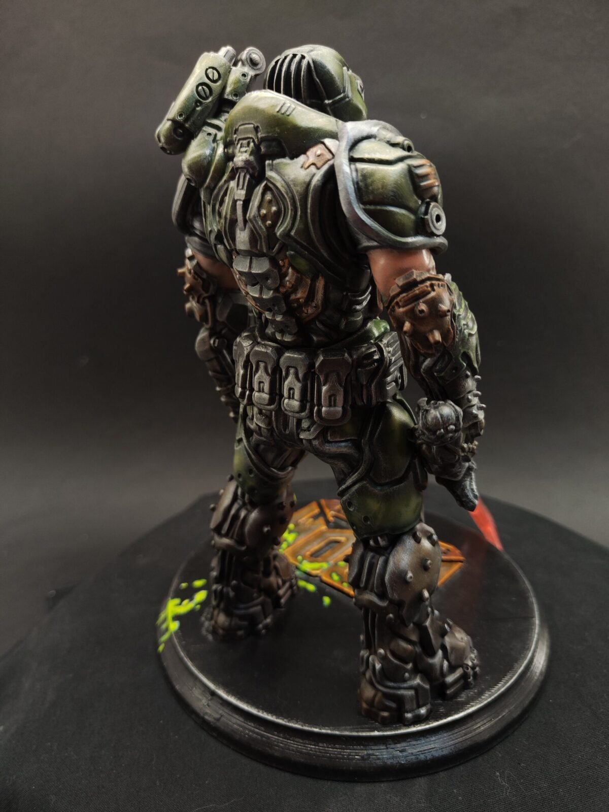 Side angle with focus on shoulder armor, gloves, and detailed torso sculpt