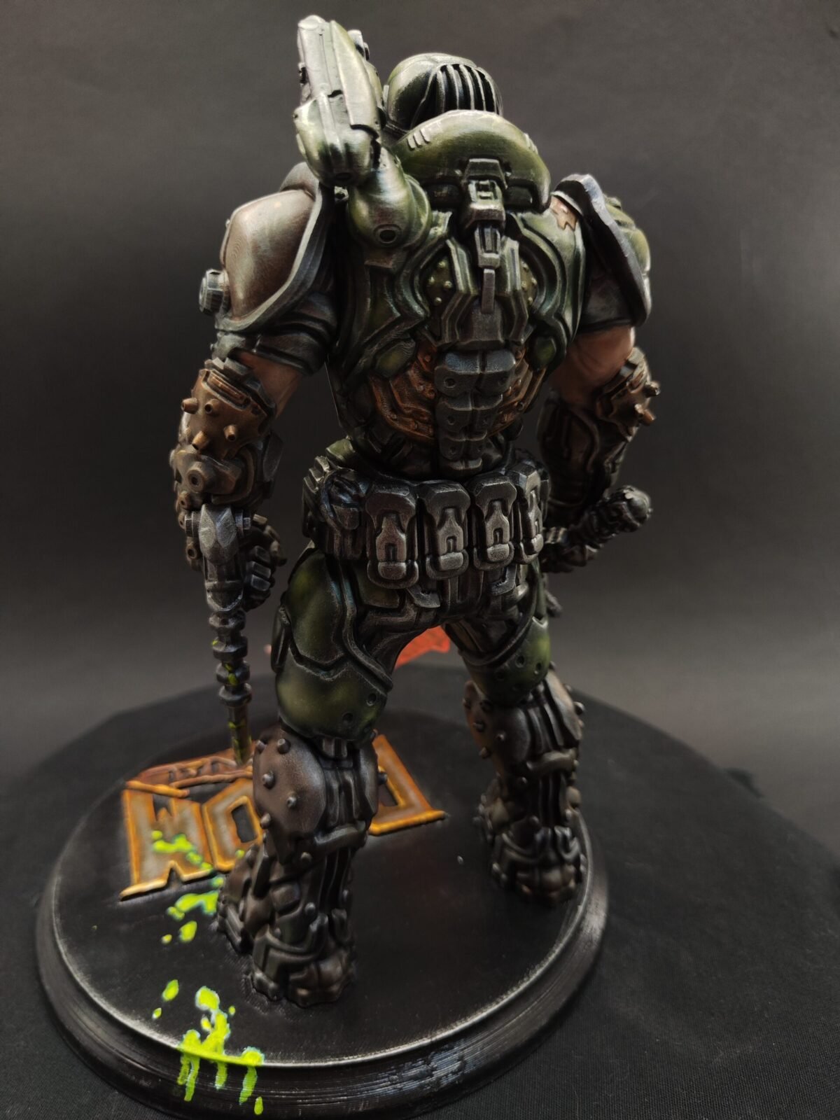 Back view showing sculpted backpack unit and leg armor segments