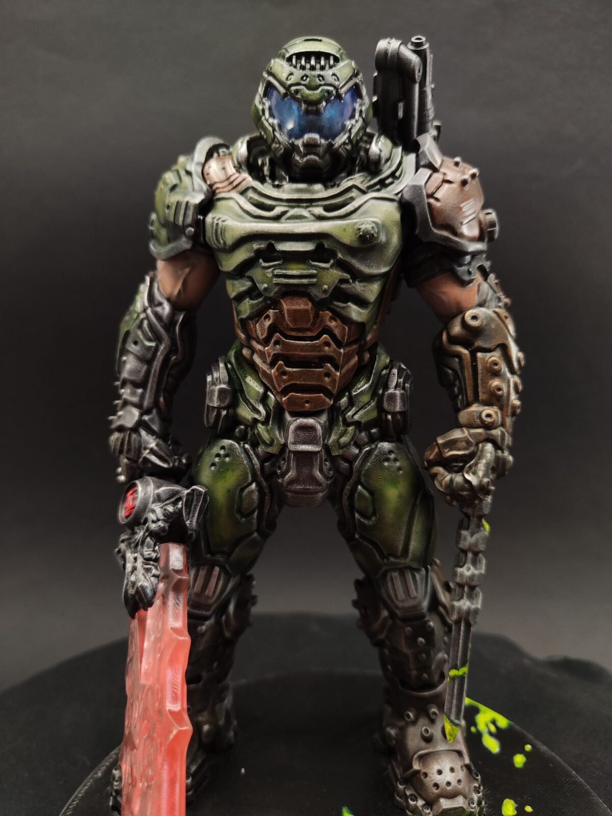 Three-quarter angle showing dynamic pose, muscular sculpt, and airbrushed armor