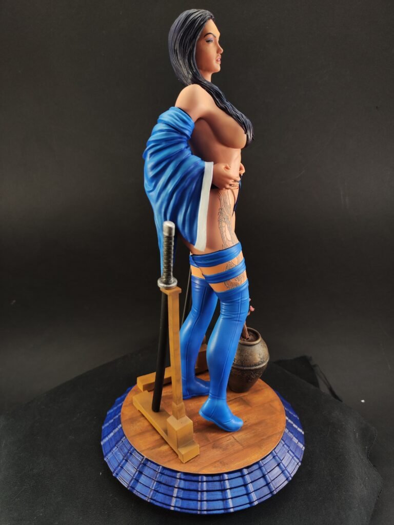 Side view of Geisha Psylocke resin figure in dynamic stance with twin blade pose