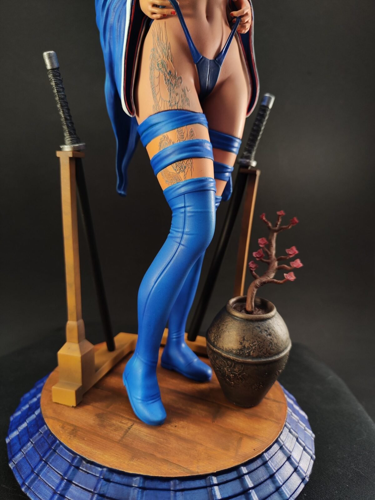 Angled close figure view showing Geisha elements fused with battle gear