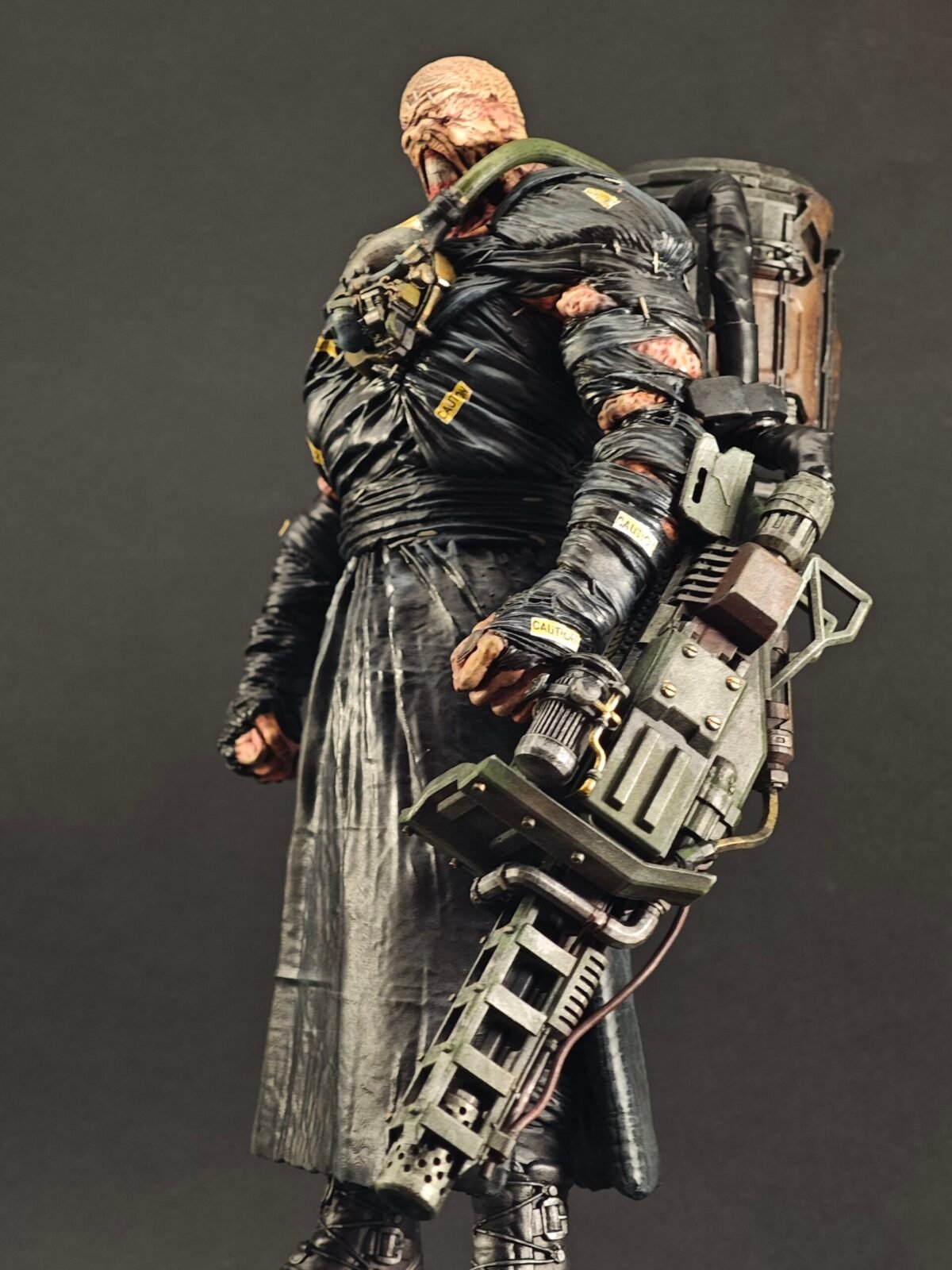Side angle of mutated arm sculpt and damaged suit sections