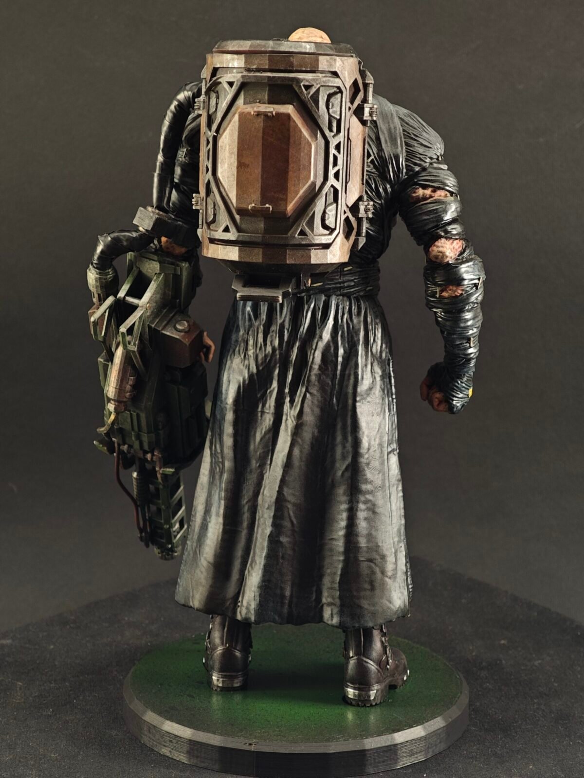 Back view of Nemesis highlighting sculpted coat flow and bulky silhouette