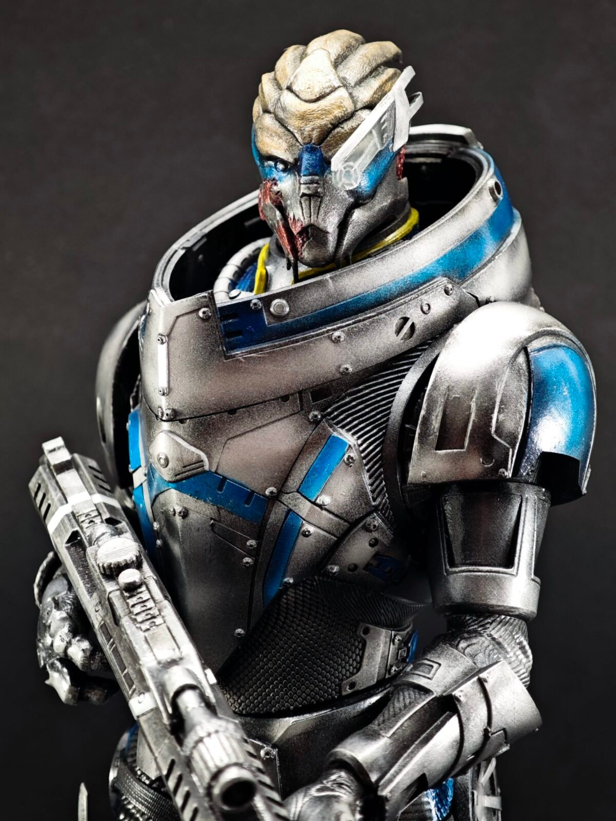 Angled front shot of Turian warrior in combat stance with tactical gear