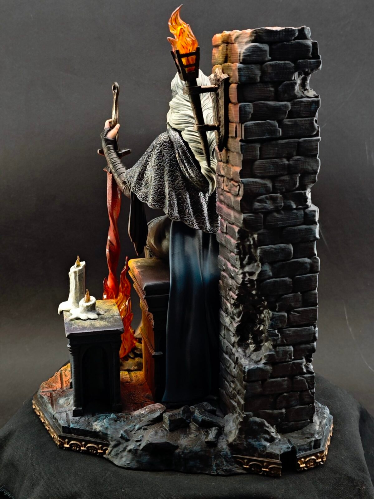 Back view of resin figure showing hood and layered cloak texture