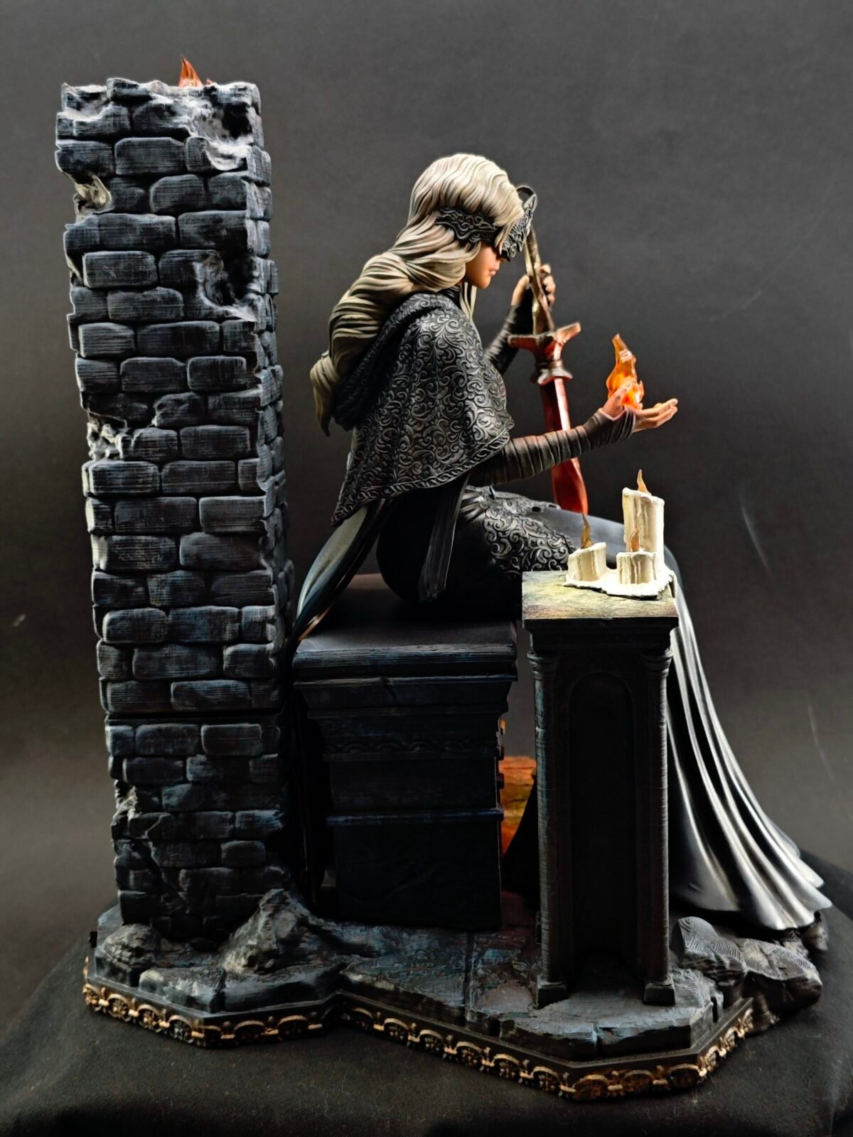 Right side angle of cloaked Fire Keeper holding fire with subtle lighting detail