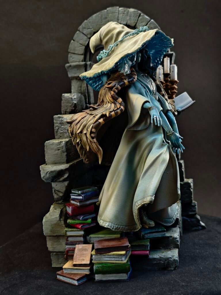 Right-side view of resin figure showing layered fabrics and mystical presence
