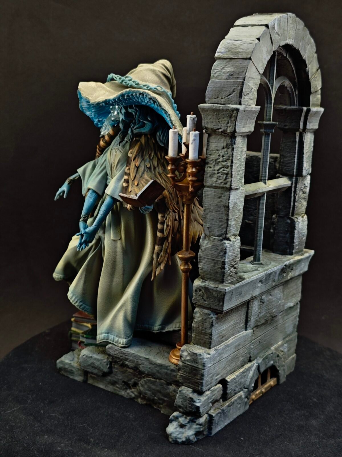 Left profile showing extended hand pose and detailed robe texture