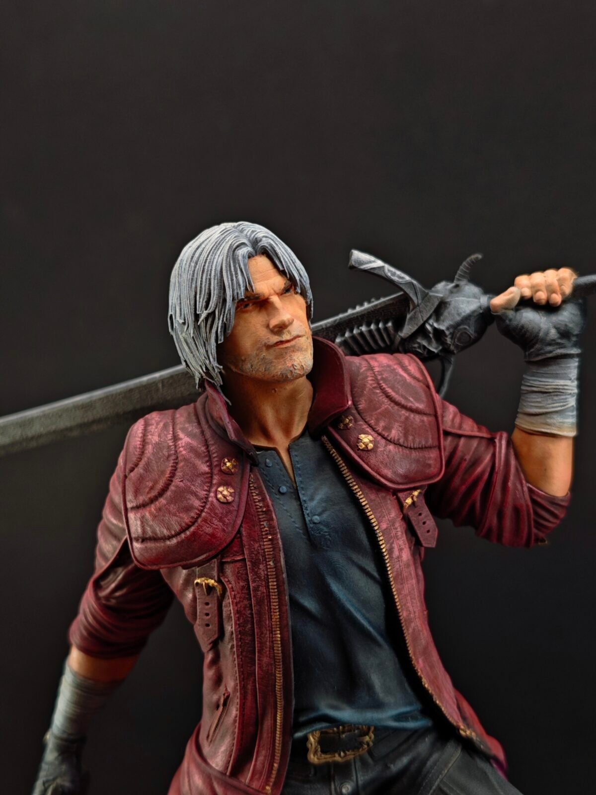 Close-up of Dante’s face with confident smirk and white hair