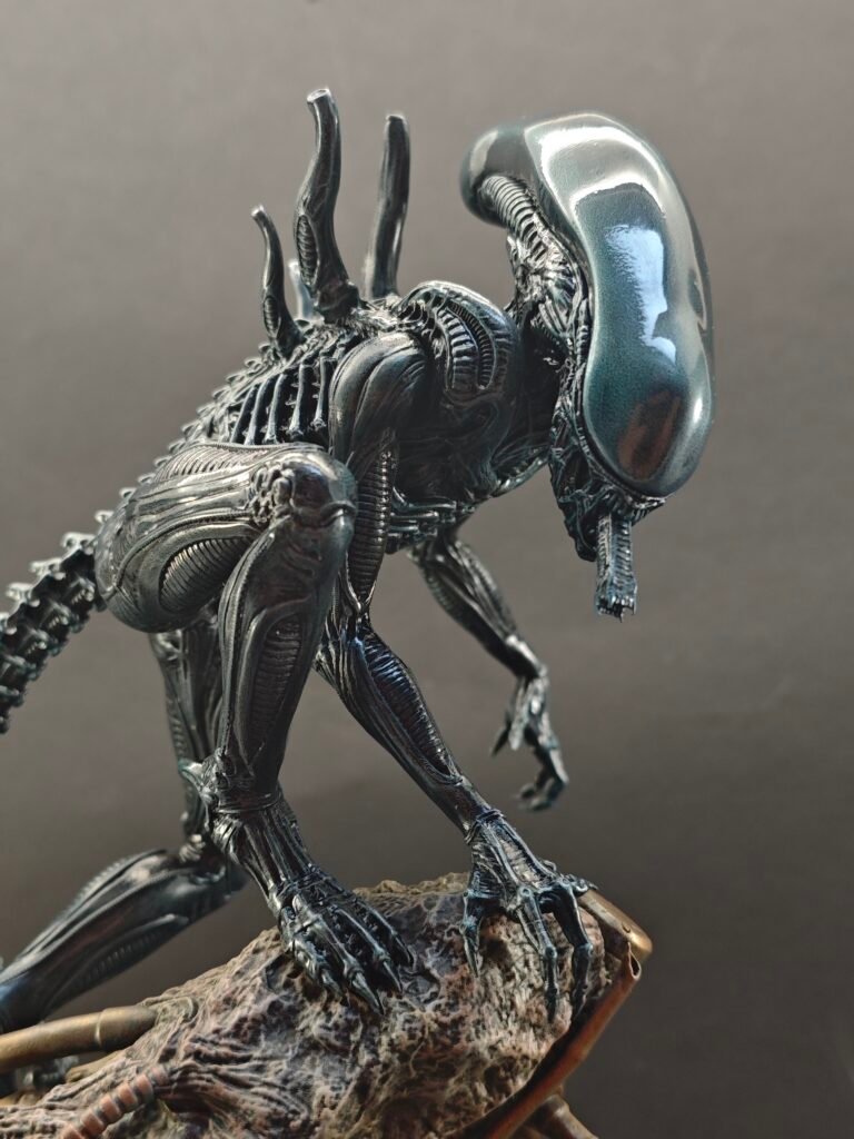 Three-quarter angle of sci-fi horror figure posed on textured display base