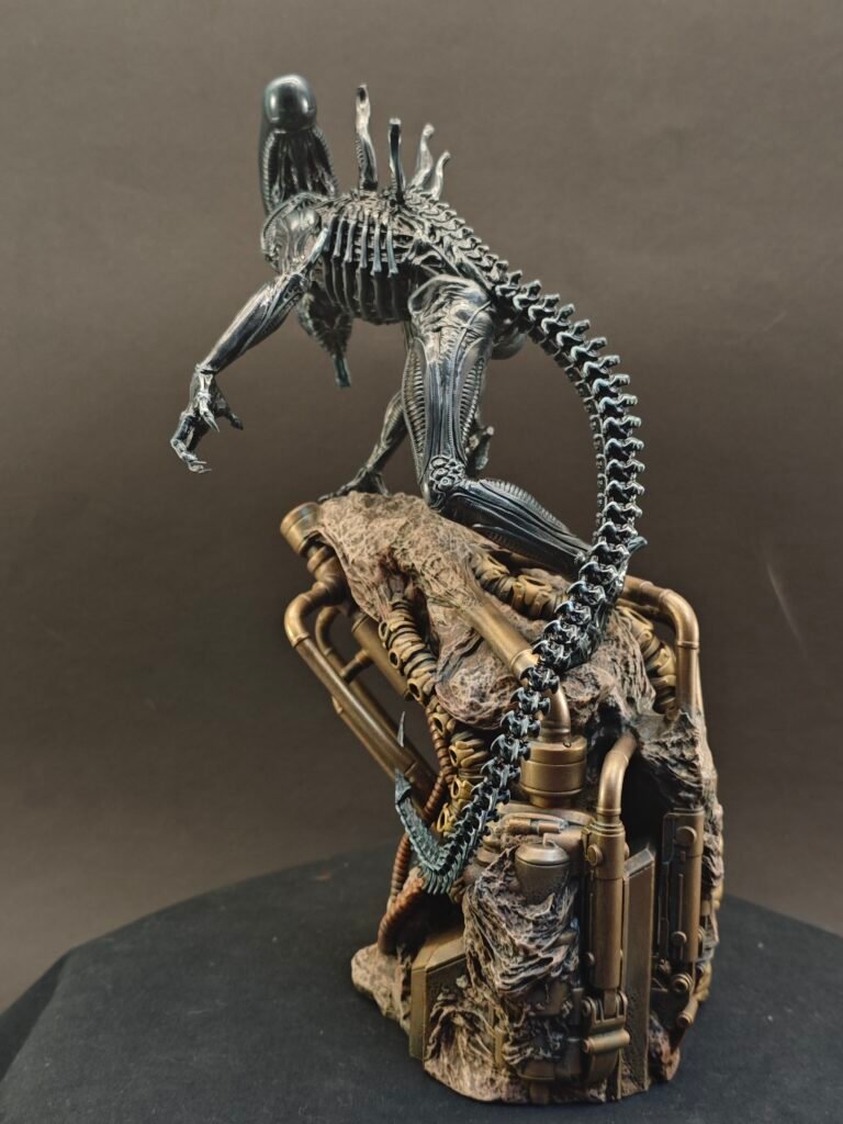 Side view of Xenomorph resin figure with elongated head and sculpted tail in motion