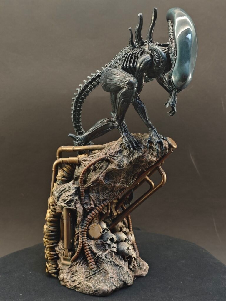 Full-body figure of alien creature with menacing pose and airbrushed shadows