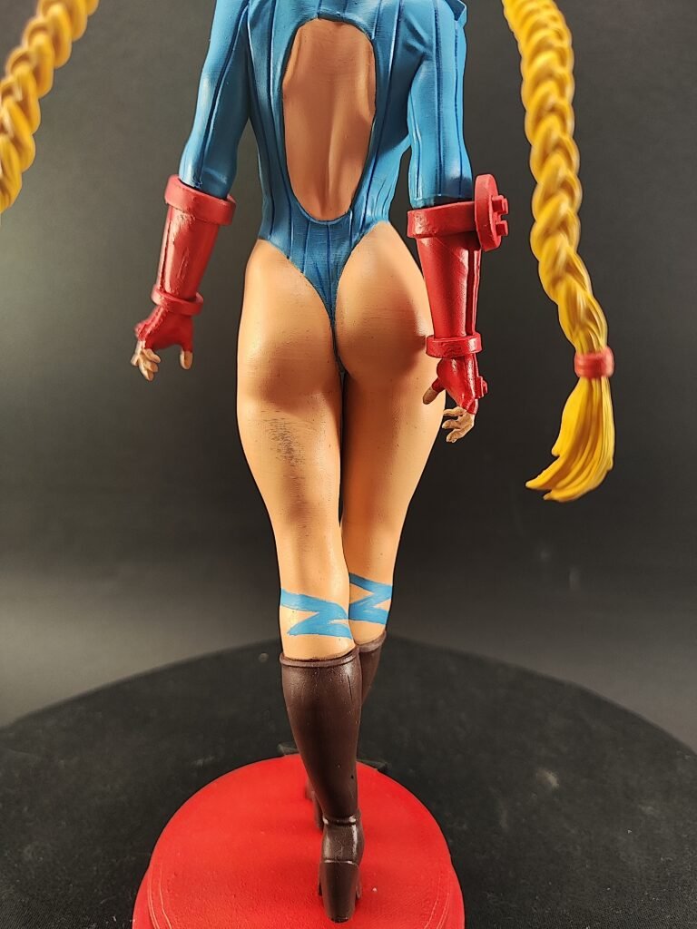 Back angle capturing Cammy’s shoulder blades, gloves, and leg alignment