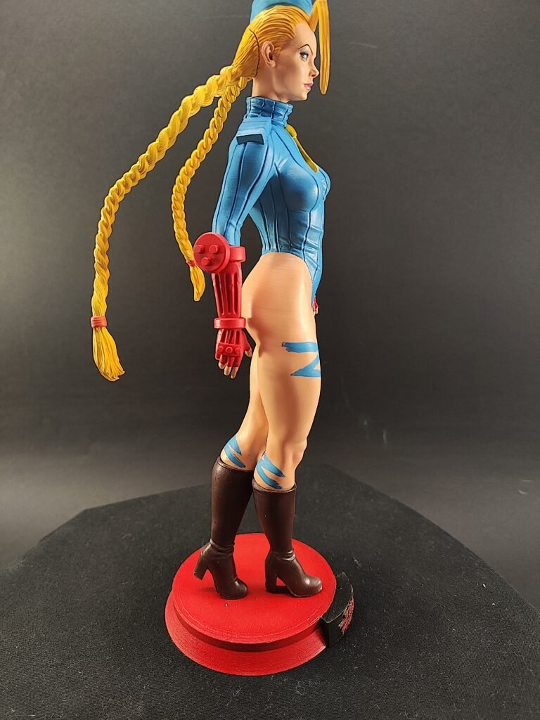 Right-side view of Cammy resin figure showing extended arm and leg tension