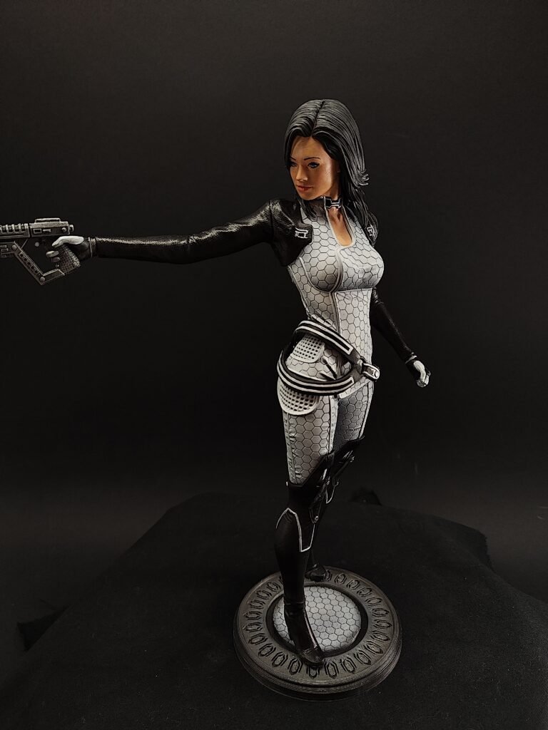 Side view of Miranda resin figure in white armor standing in confident pose