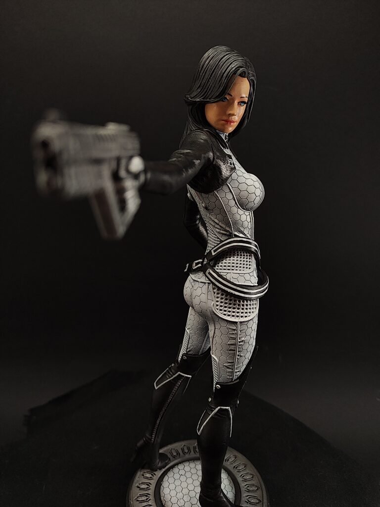 Miranda figure posed with confidence, gun holster and sci-fi suit details visible