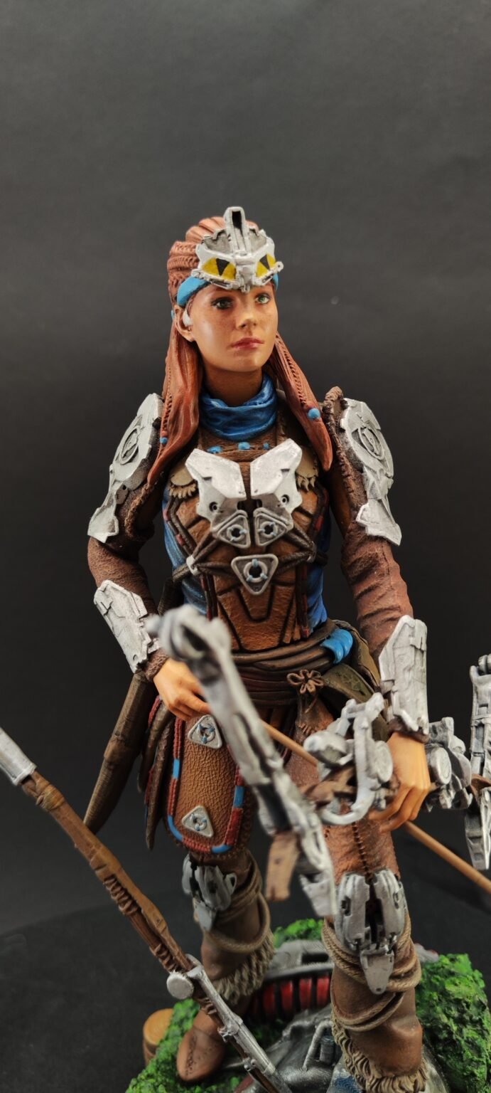 Three-quarter angle with Aloy mid-motion and weapon drawn