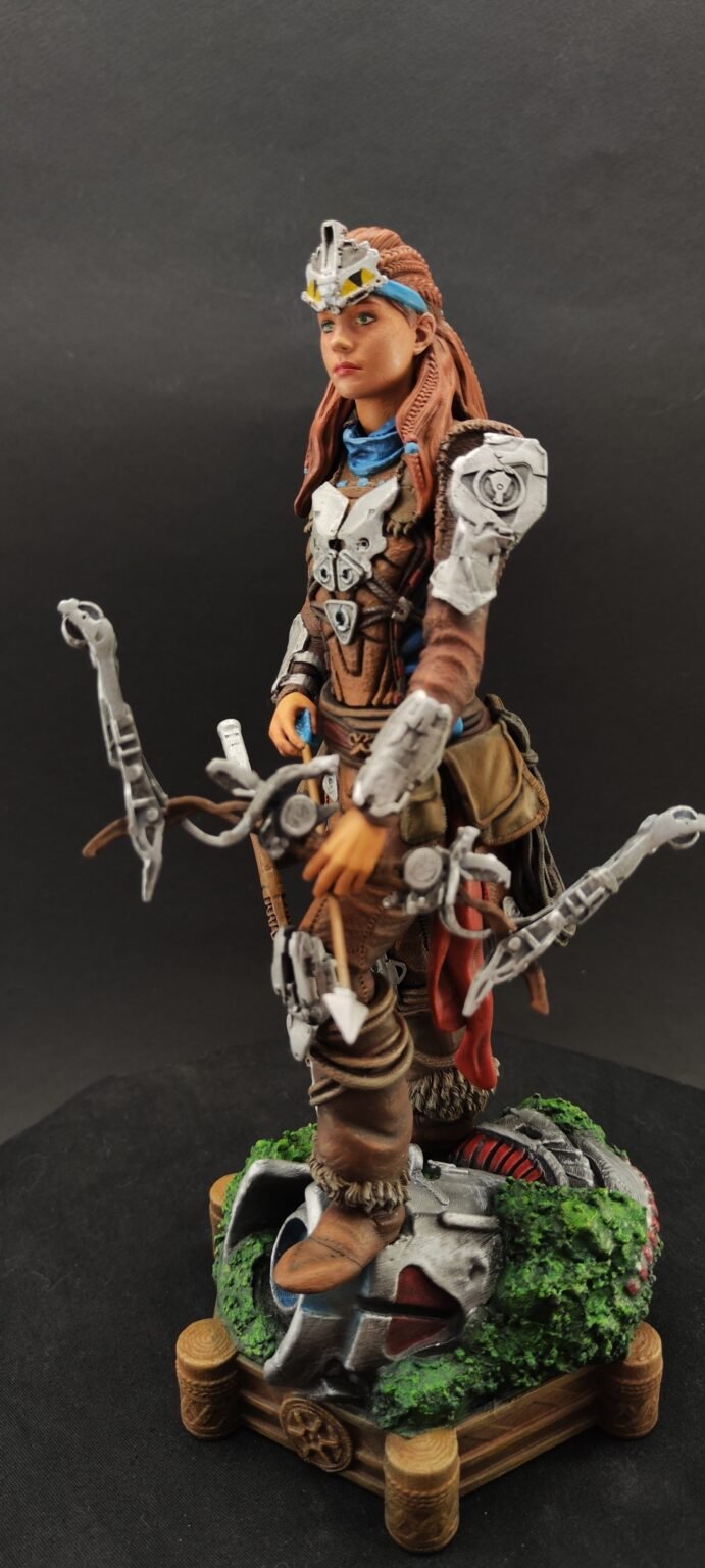 Side view highlighting Aloy's detailed armor and braided hair
