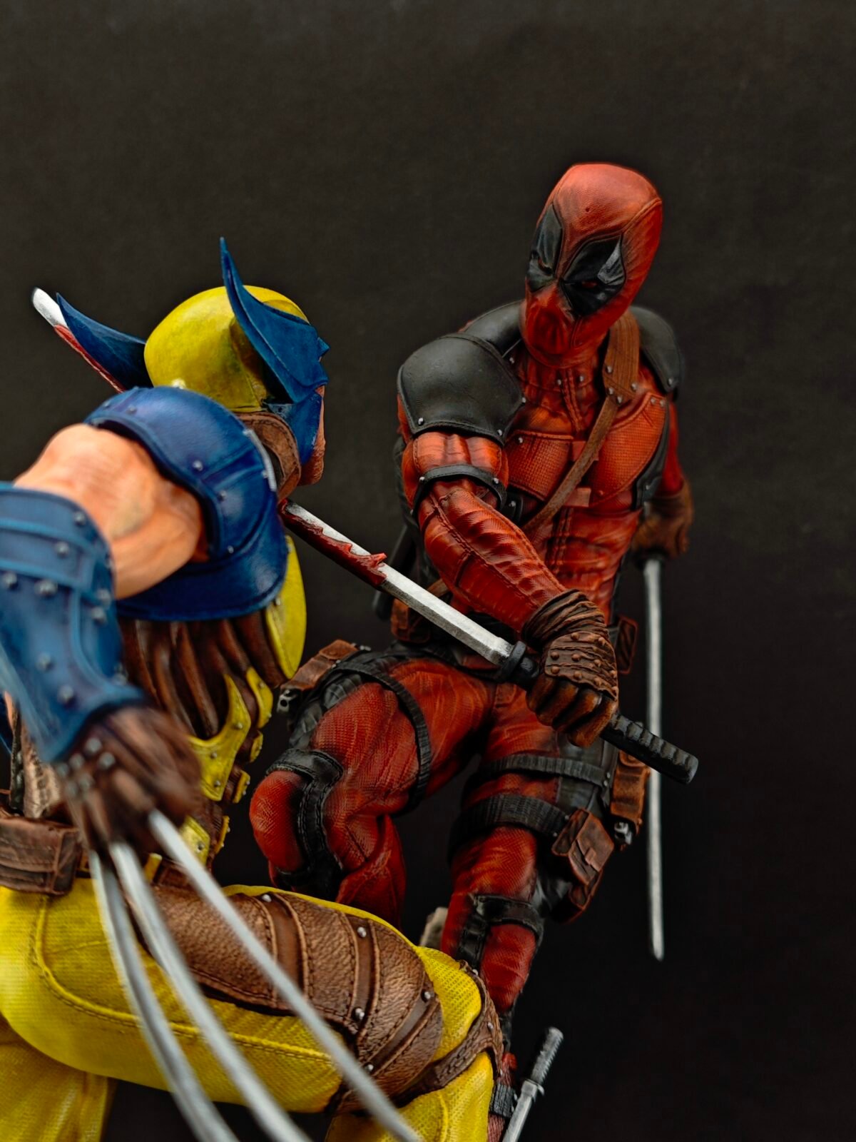 Angled front shot of red mercenary ready to strike with detailed sculpted outfit