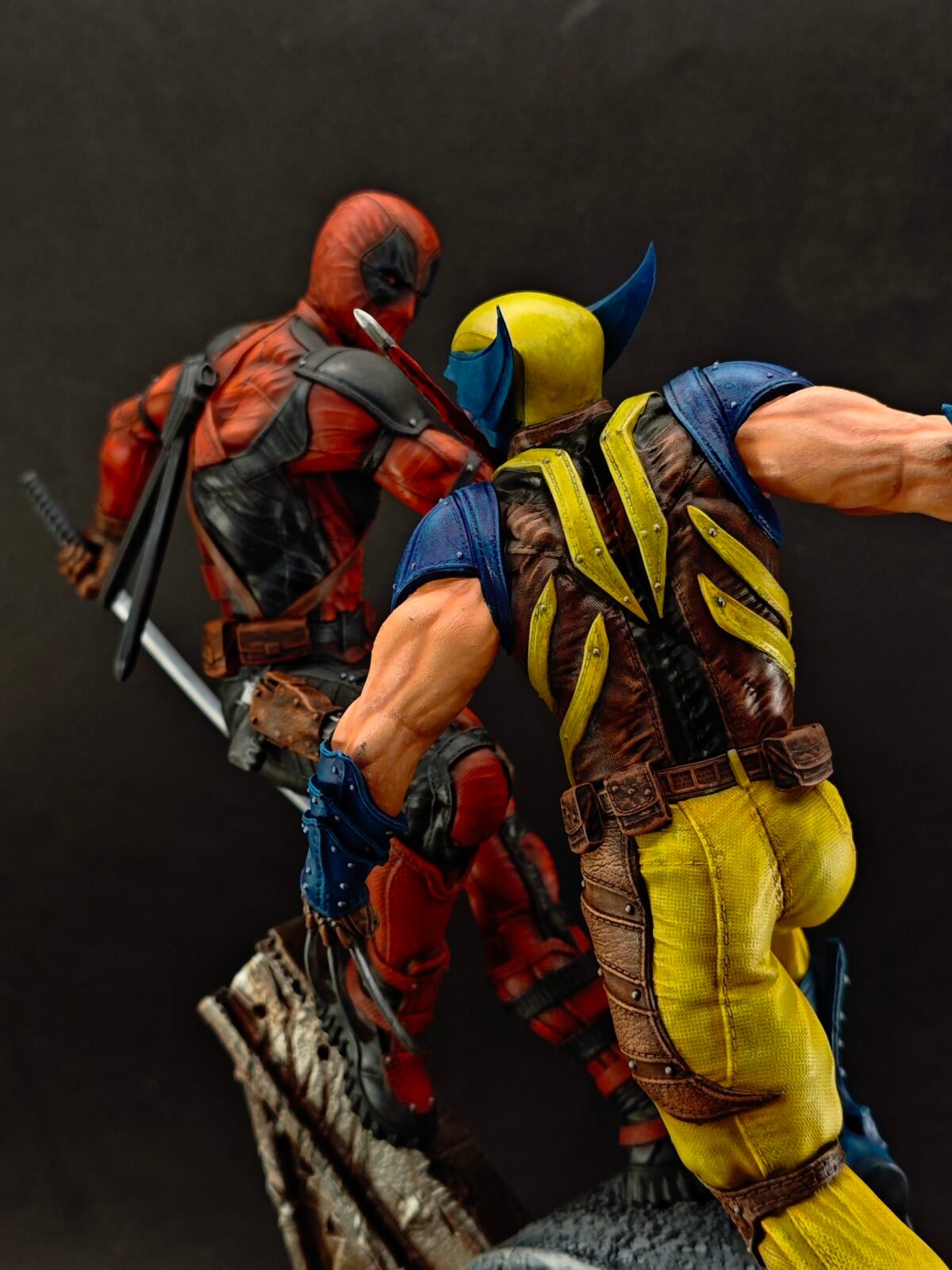 Three-quarter pose of both figures mid-combat with airbrushed battle wear