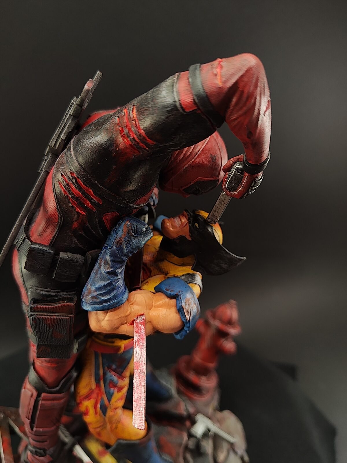 High-resolution view of Deadpool vs Wolverine hand-painted features