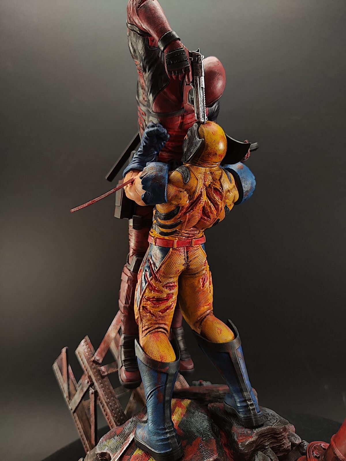 Resin figure showing Marvel-inspired action scene from side angle
