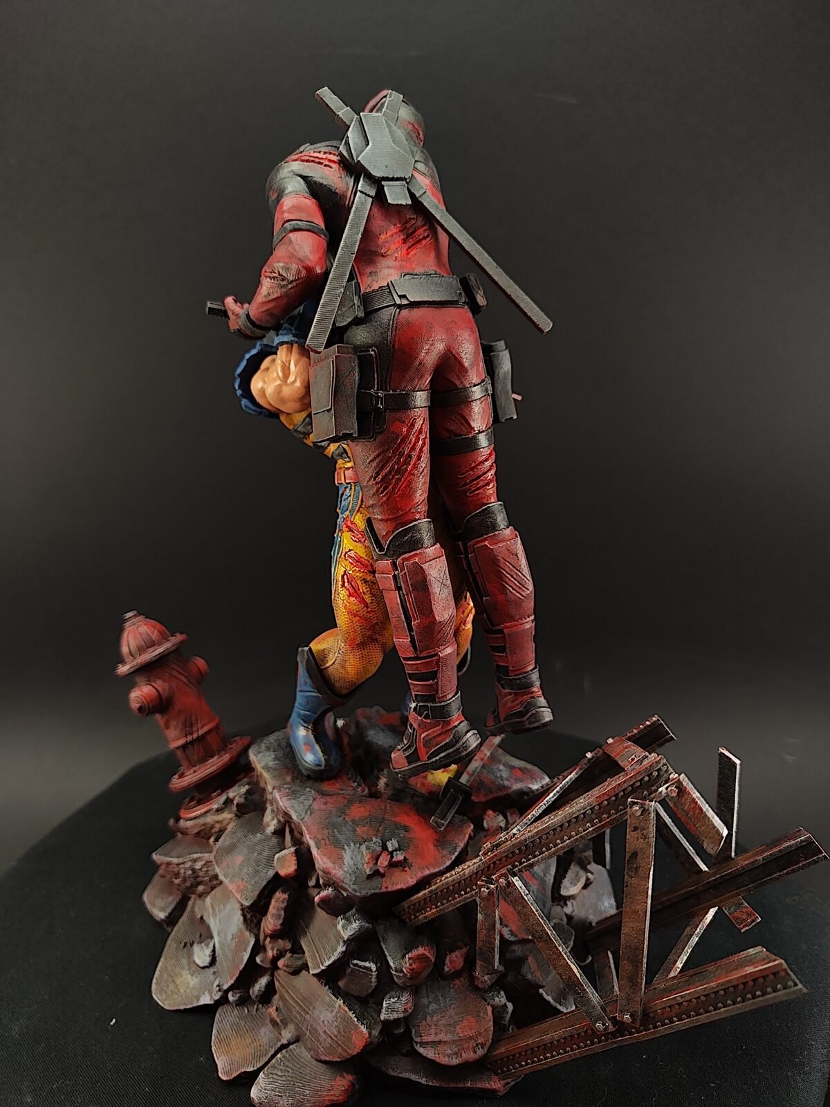 Detailed shot of Wolverine’s claws and Deadpool’s swords